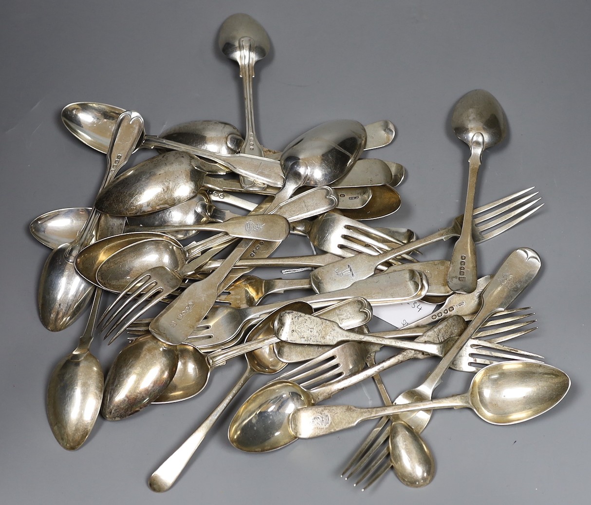 A mixed part canteen of George III and later silver mainly fiddle or fiddle and thread flatware, various dates and makers, comprising thirty two items